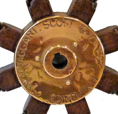 The steering wheel's hub is marked with the makers name image