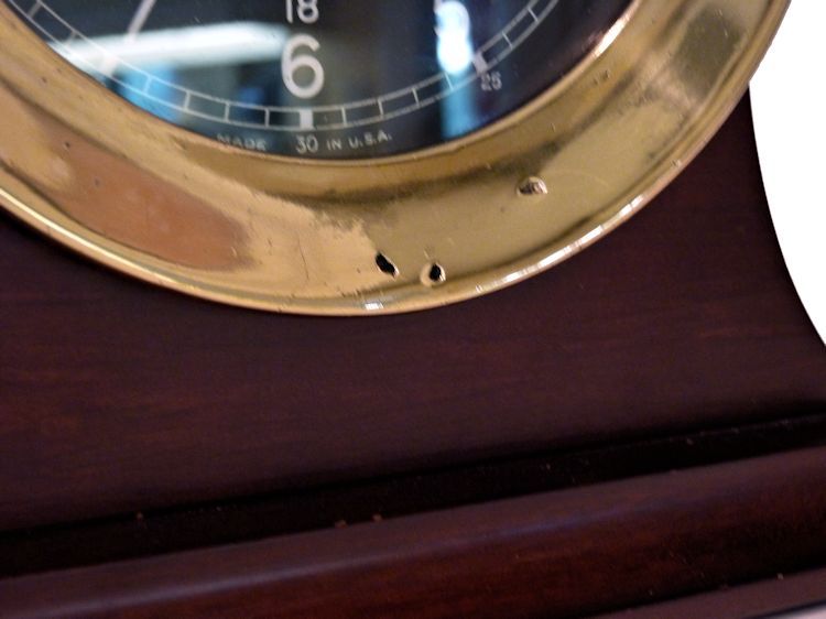 Damage on bezel of the USS Adhara clock image