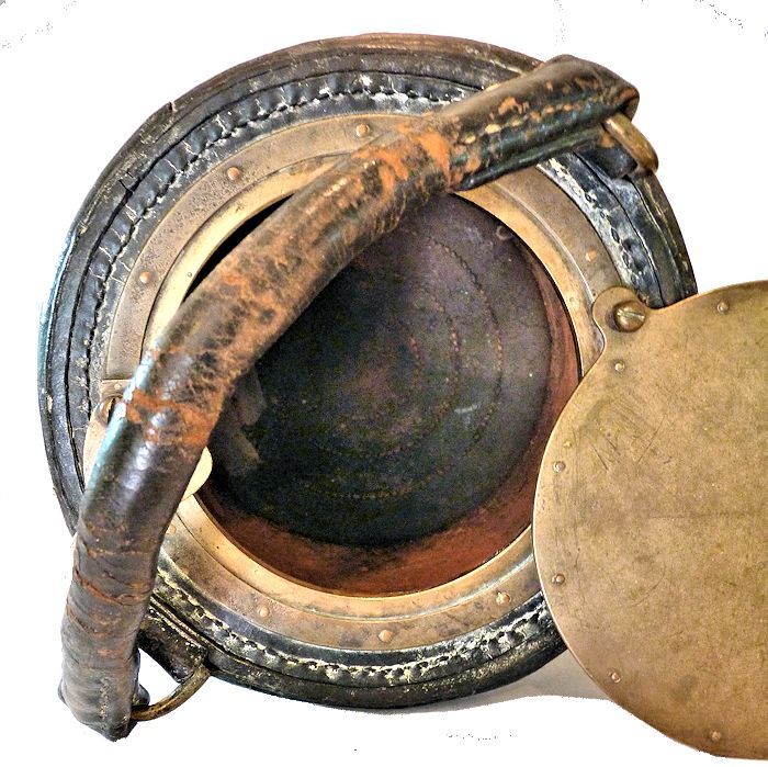 Inside of bucket showing the bronze cover and cloth lining