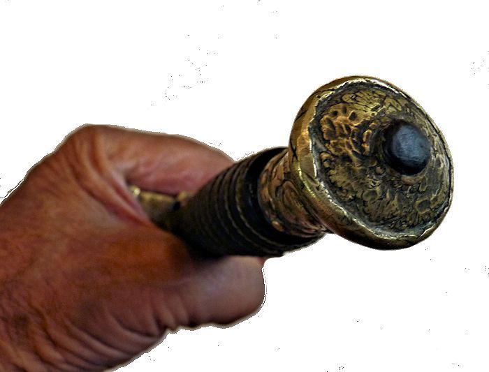 The end of the pommel showing the tang image