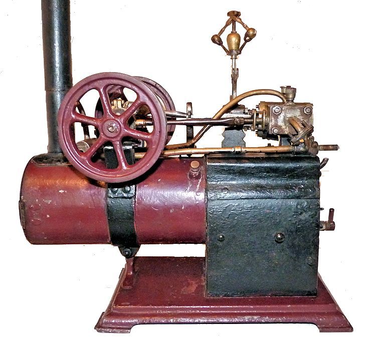 Closeup of side view of antique steam engine model image