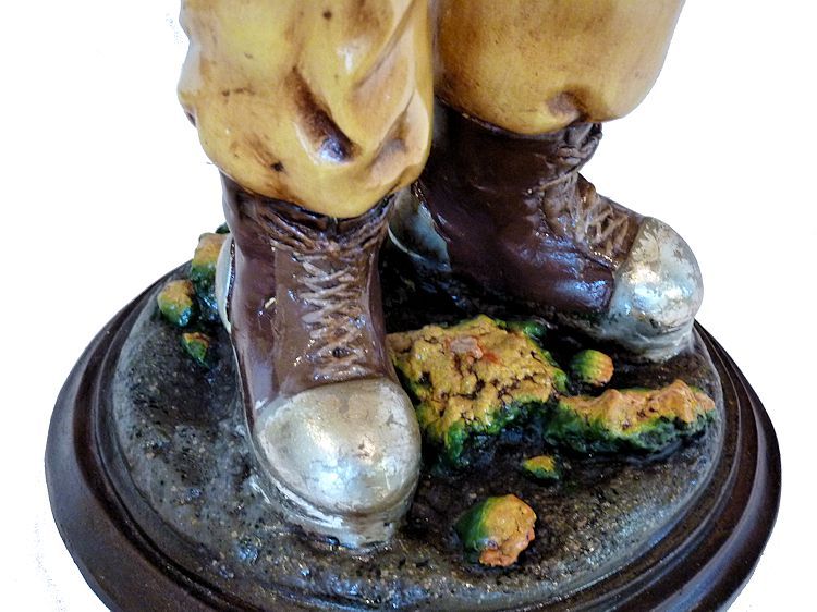 Dive boots on vintage diver statue image